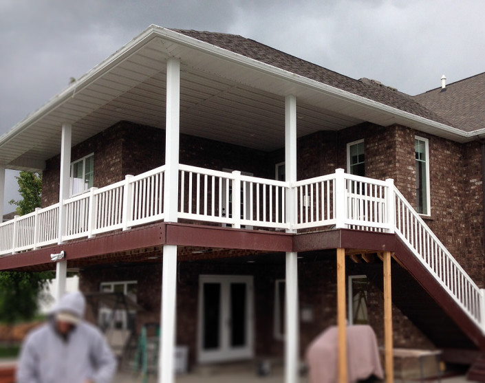 Vinyl handrail on deck and stairs of brick home