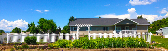 Vinyl picket fence in front of garden--view from garden side.
