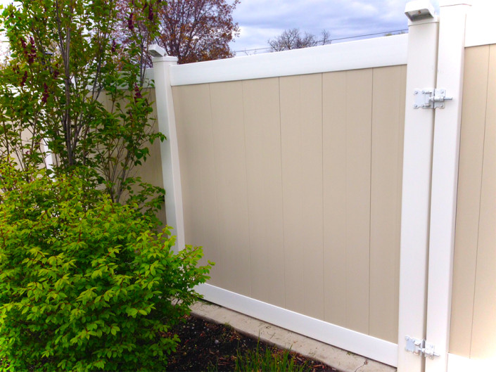 Two-Tone Vinyl Privacy Fence with Gate (on Right) with LED Lights Integrated Into Caps